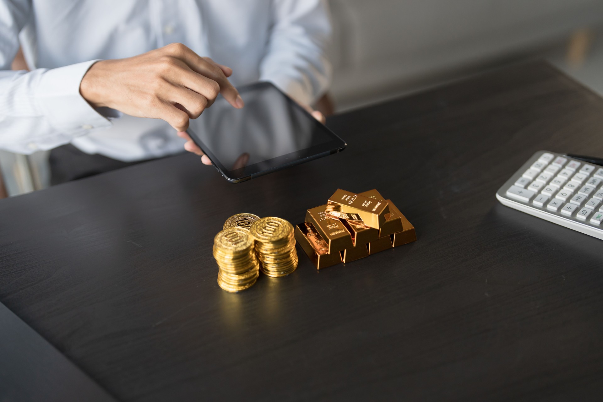 Gold Trading business man hand offering goldÂ Investment in gold mining company or Trading gold on the stock exchangeÂ Rising gold prices.